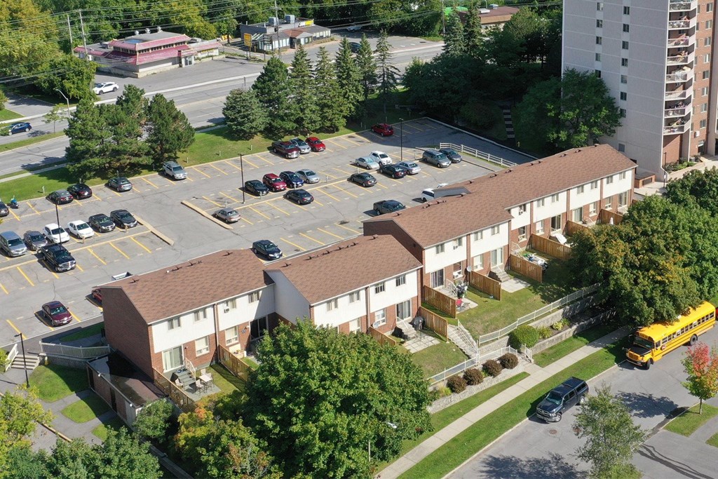 Concorde Townhouses exterior with parking lot in Ottawa, ON