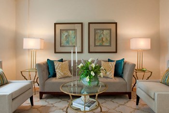 Creekside Townhomes in Oshawa, ON stylish living room with beige couch and glass coffee table - Photo Gallery 3