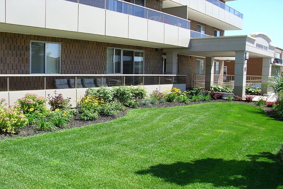 Building Exterior with green spaces at Bradford Place Apartments in Bradford, ON