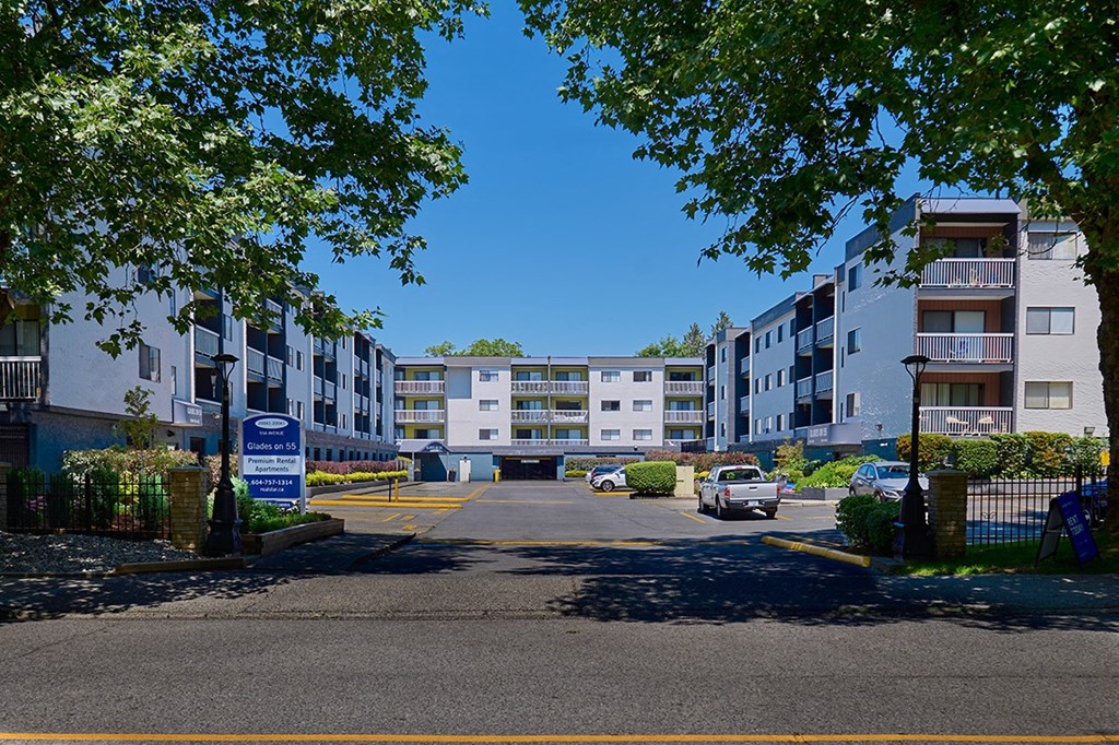 a parking lot in front of an apartment complex