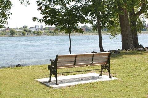 High Street Apartments neighbouring park bench in Fort Erie, ON