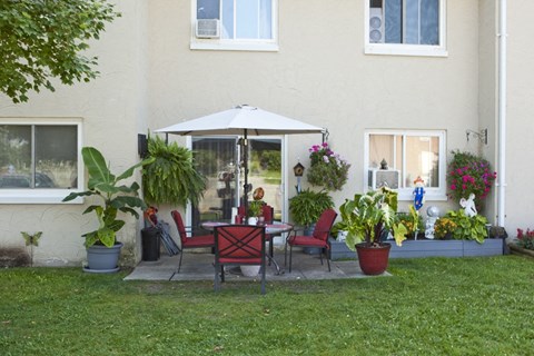 High Street Apartments private terrace featuring patio table set in Fort Erie, ON