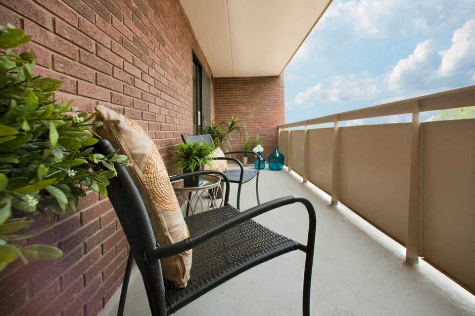 In-suite private balcony with seating at Hillcrest Terrace in St. Catharines, ON