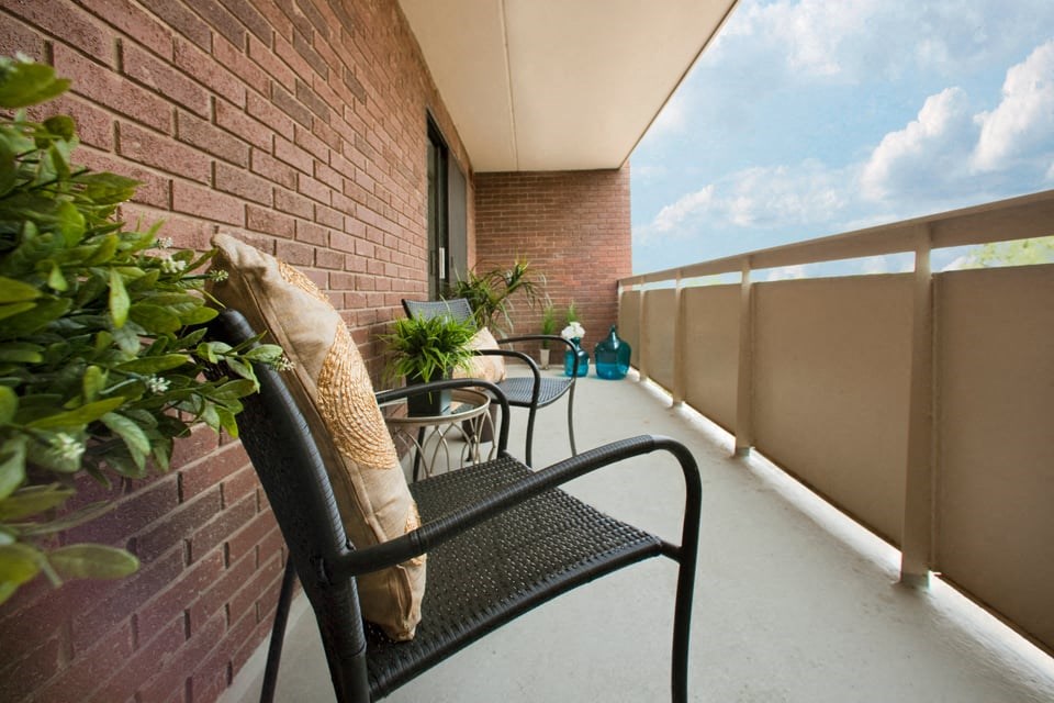 In-suite private balcony with seating at Hillcrest Terrace in St. Catharines, ON