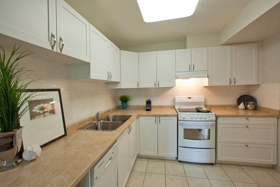 Kitchen with dishwasher and stove at Hillcrest Terrace in St. Catharines, ON