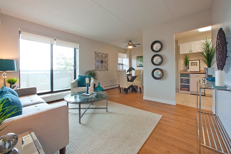 Living room opening up to dining room and kitchen at Hillcrest Terrace in St. Catharines, ON