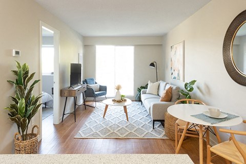 Horizon Towers in Burnaby, BC brightly lit living room with access to private balcony