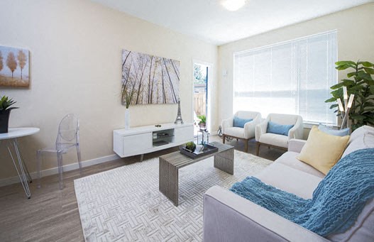 Hoylake Apartments in Victoria, BC spacious living room with access to private balcony
