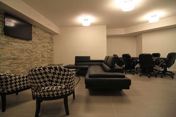 Rittenhouse Place in Kitchener, ON social room with flat screen tv