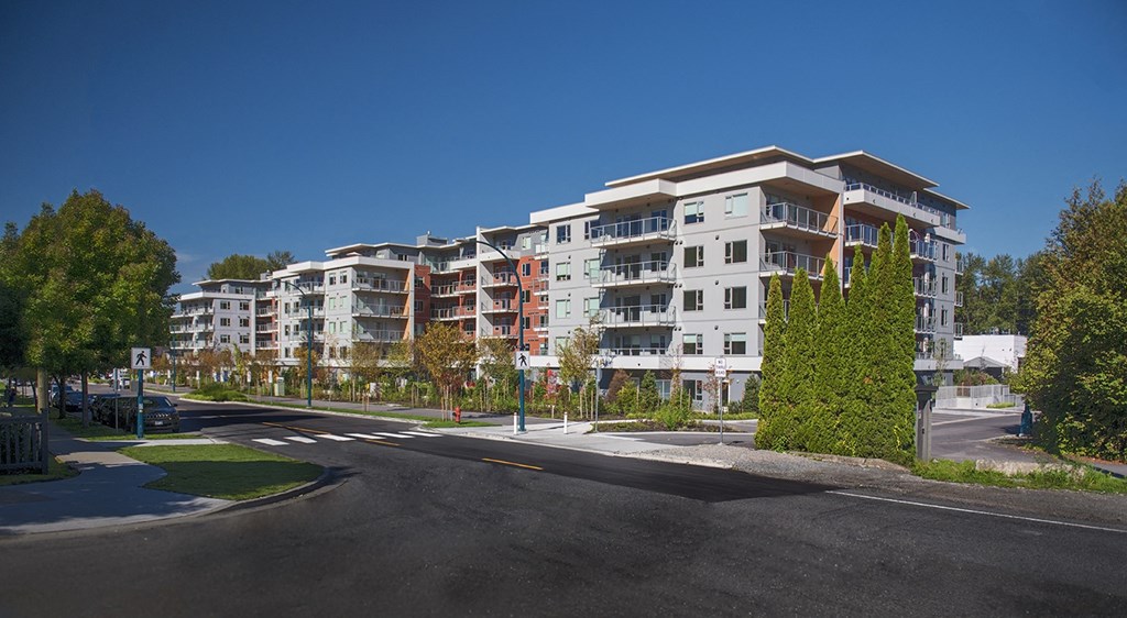 a view of an apartment building on a city street