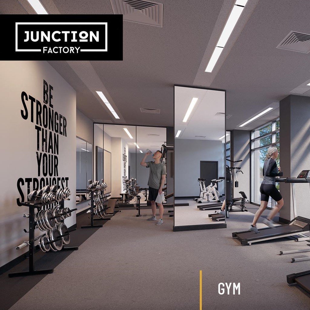fitness facility with equipment at  Junction Factory Apartments in Toronto Ontario