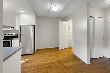 Kensington Apartments in Brockville showing dining room with storage room off side wall, kitchen on left and entry on right - Photo Gallery 4
