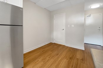 Kensington Apartments in Brockville dining room as seen from kitchen with entry on right side - Photo Gallery 5