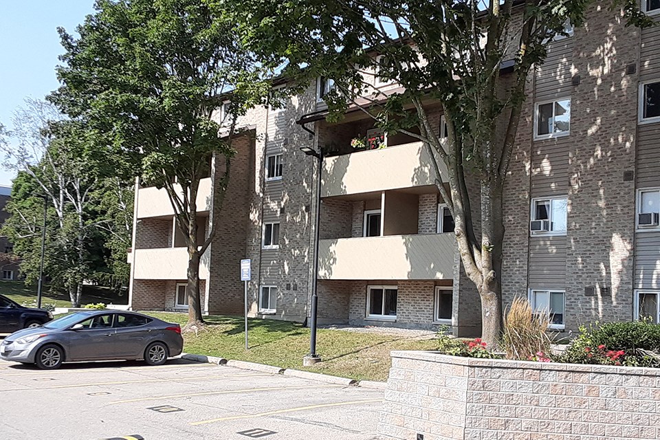 Kensington Apartments in Brockville showing suites with balconies at front of building