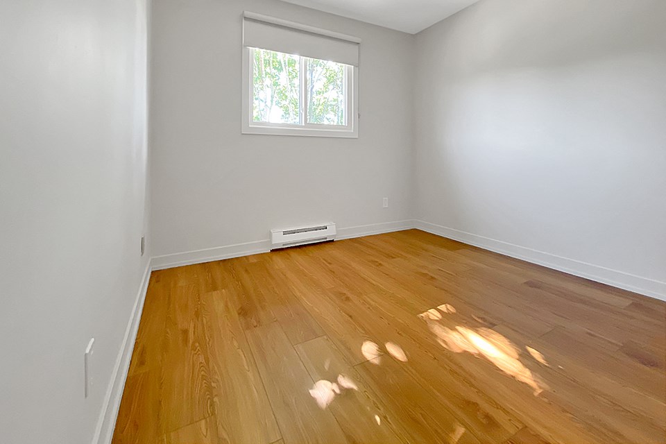 Kensington Apartments second bedroom looking towards window with blackout blinds from doorway to room