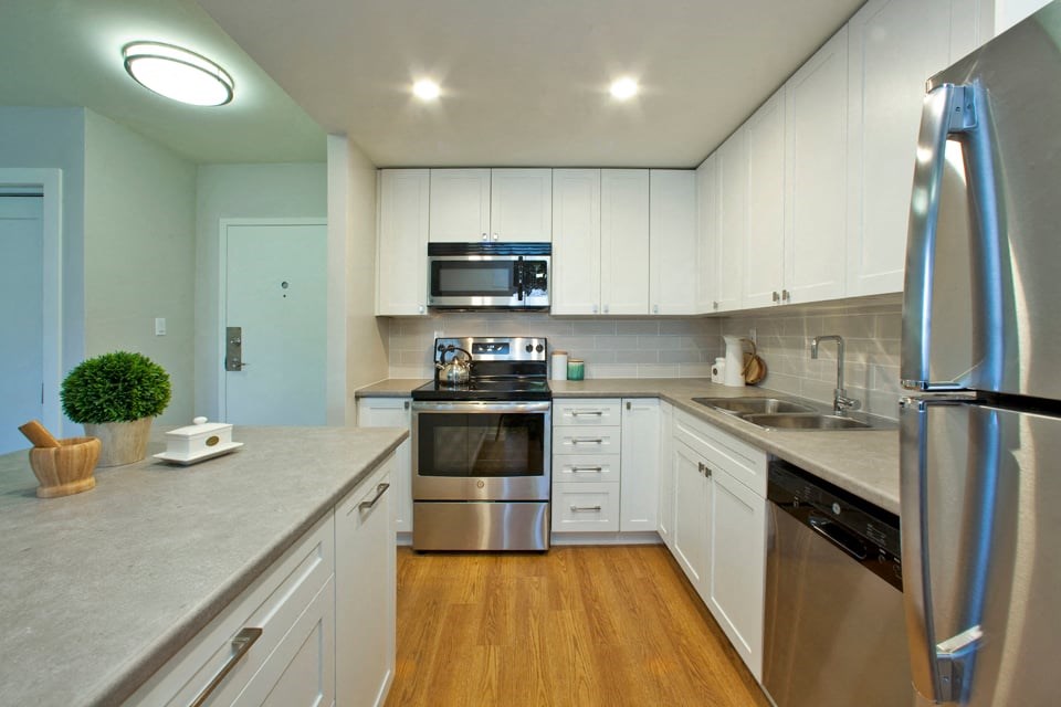 Laura Secord Apartments modern kitchen with white cabinetry in Niagara Fall, ON