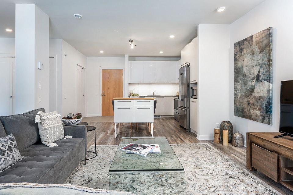 Open concept 2 bedroom apartment with view into kitchen at Le Saint-Laurent Apartments in Brossard