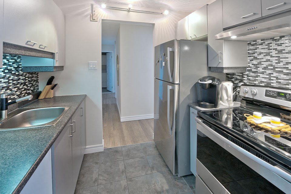 Les Jardins Hauterive in Sherbrooke, QC kitchen with stainless steel appliances