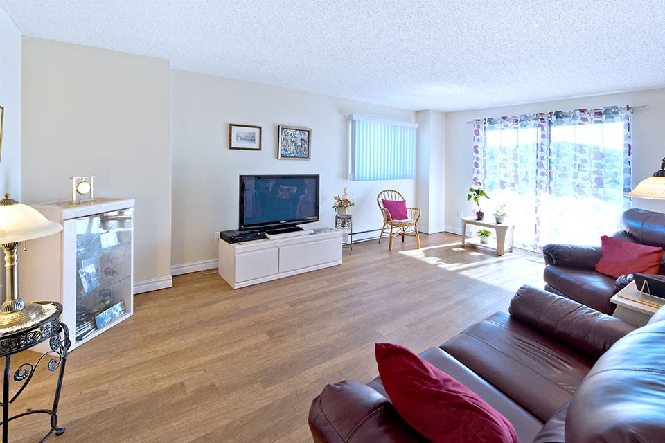 Les Jardins Hauterive in Sherbrooke, QC living room with luxury vinyl flooring throughout