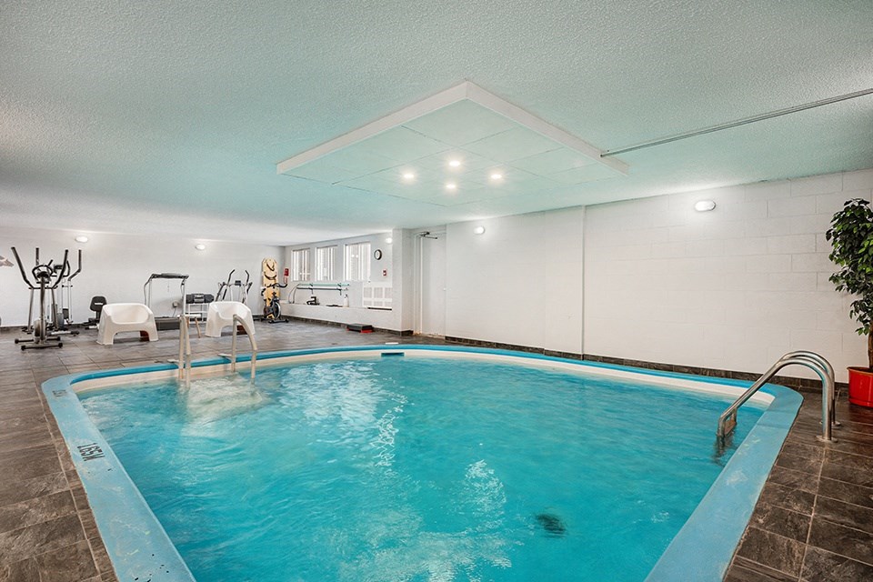 a swimming pool with a blue pool