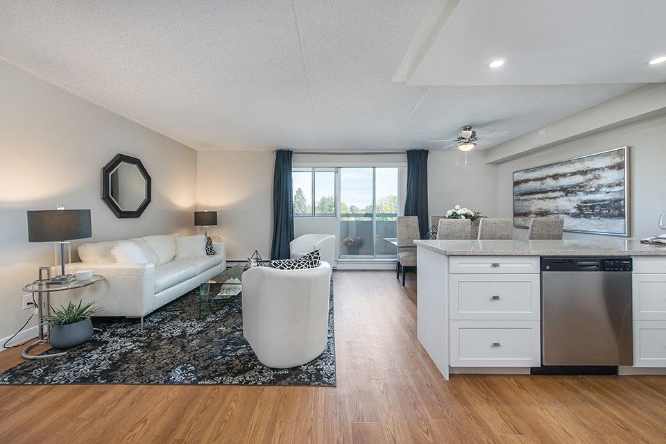 Lorneville Apartments open concept suite with view of living room and dining area from kitchen in Cornwall, ON