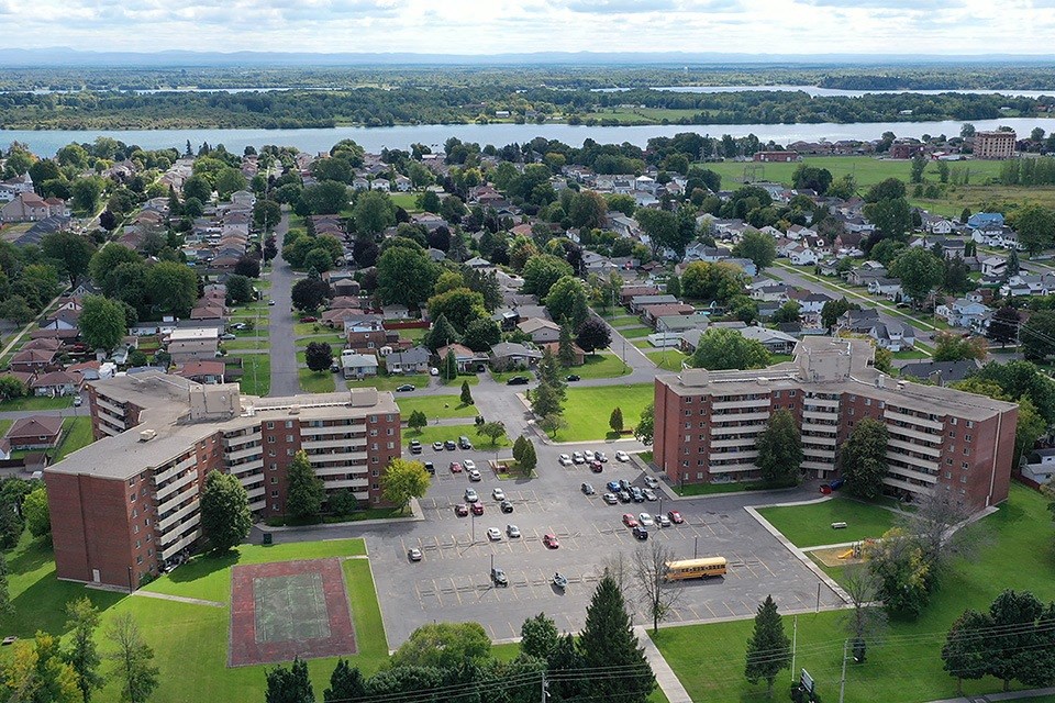 Exterior grounds, showing north side of building, and looking towards the St. Lawrence River, at Lorneville Apartments in Cornwall, ON