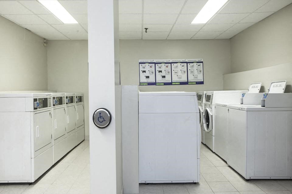 On-site laundry with washing machines and dryers and a smart card system at Lorneville Apartments in Cornwall, ON