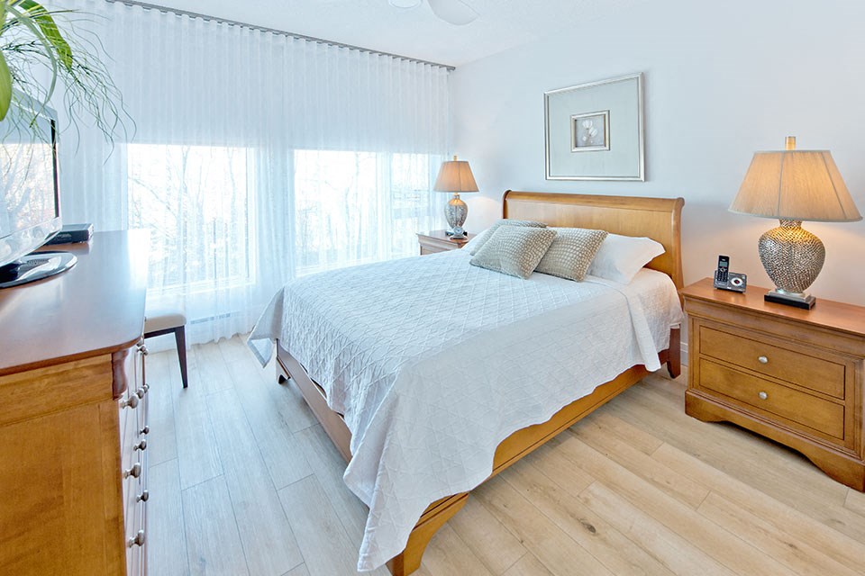 Lumineau in Sherbrooke, QC bedroom with hard surface flooring throughout