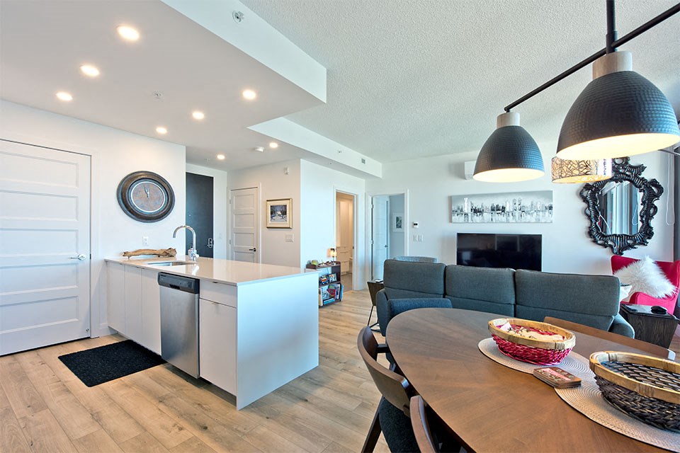 Lumineau in Sherbrooke, QC hard surfacing flooring throughout kitchen, dining and living room