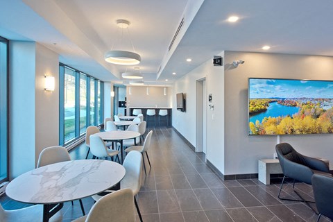 Lumineau in Sherbrooke, QC reception room with dining tables and seating