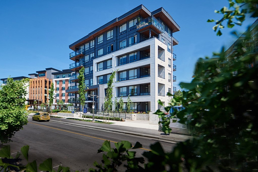 a rendering of an apartment building on a city street