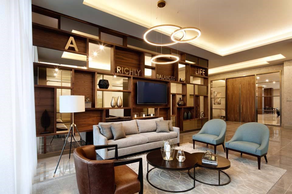 A living room with a couch, chairs, and a coffee table.