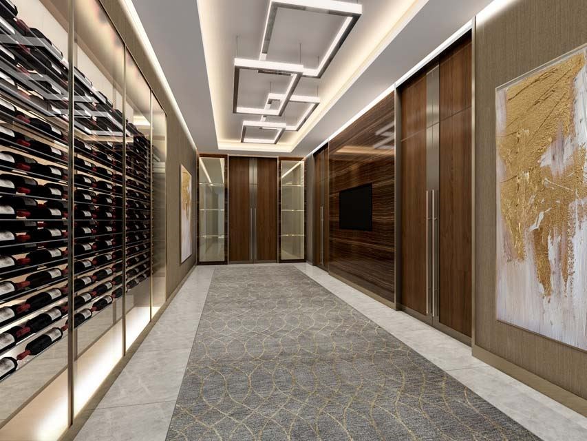 A hallway with a wine rack on the left and a painting on the right.