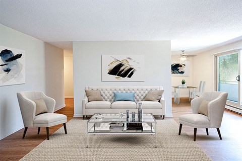 a living room with a couch and chairs and a table