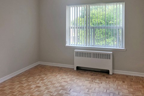 Miller Apartments in Sarnia. ON bedroom with large window and blinds