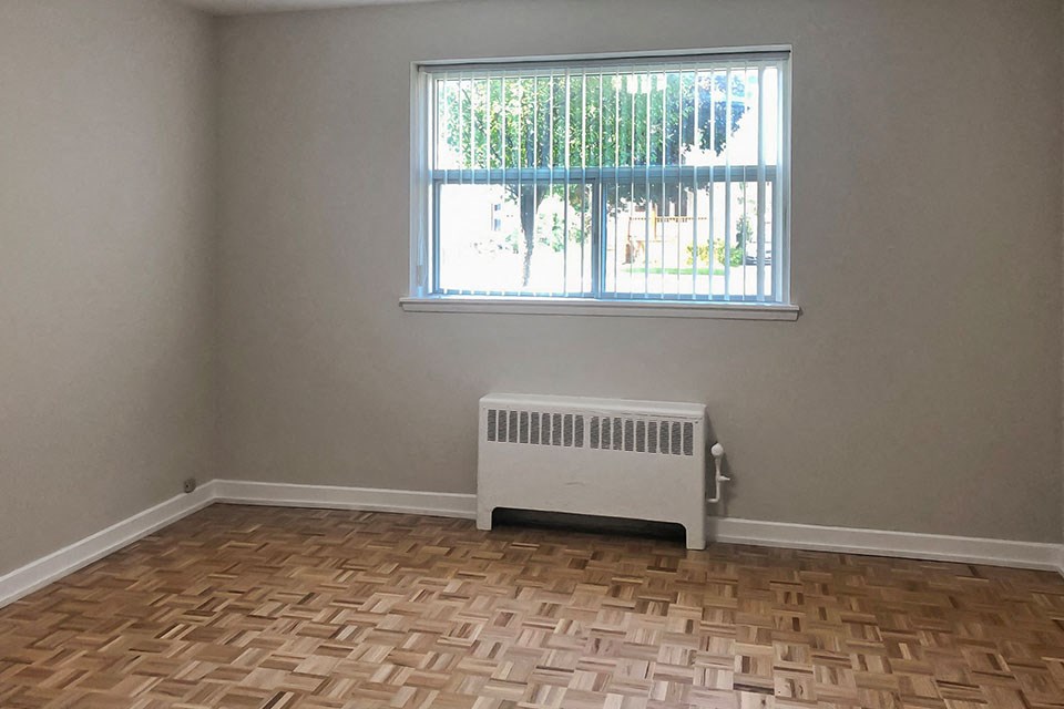 Miller Apartments in Sarnia. ON well lit bedroom with hard surface flooring