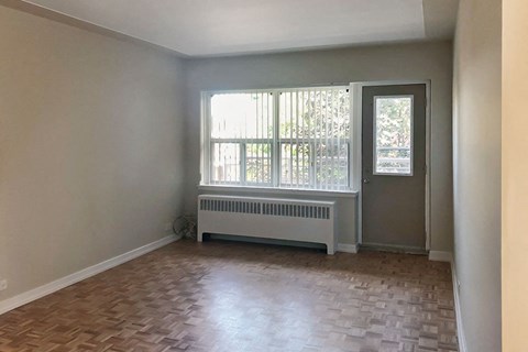 Miller Apartments in Sarnia. ON spacious living room with hard surface flooring