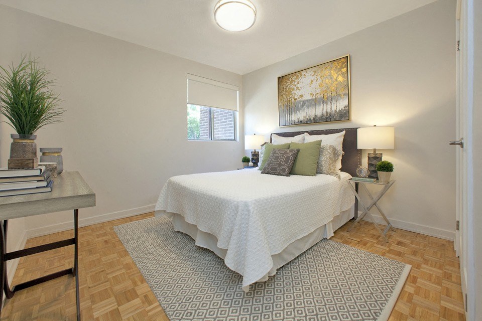 Millside Apartments in Milton, ON bedroom with hard surface flooring