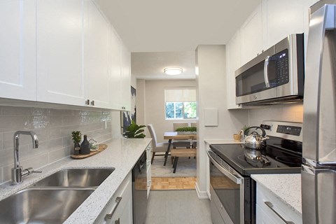 a kitchen with stainless steel appliances and a sink