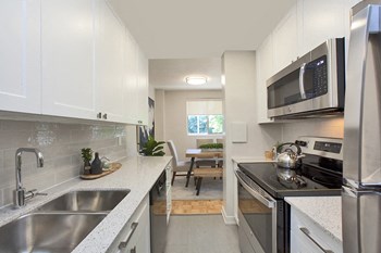 Millside Apartments in Milton, ON kitchen with stainless steel appliances - Photo Gallery 4