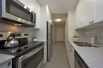 Millside Apartment in Milton, ON kitchen with upgraded cabinetry - Photo Gallery 5