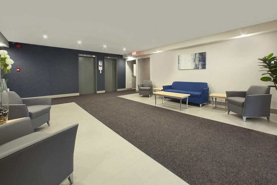 Millside Apartments renovated lobby with seating in Milton, ON