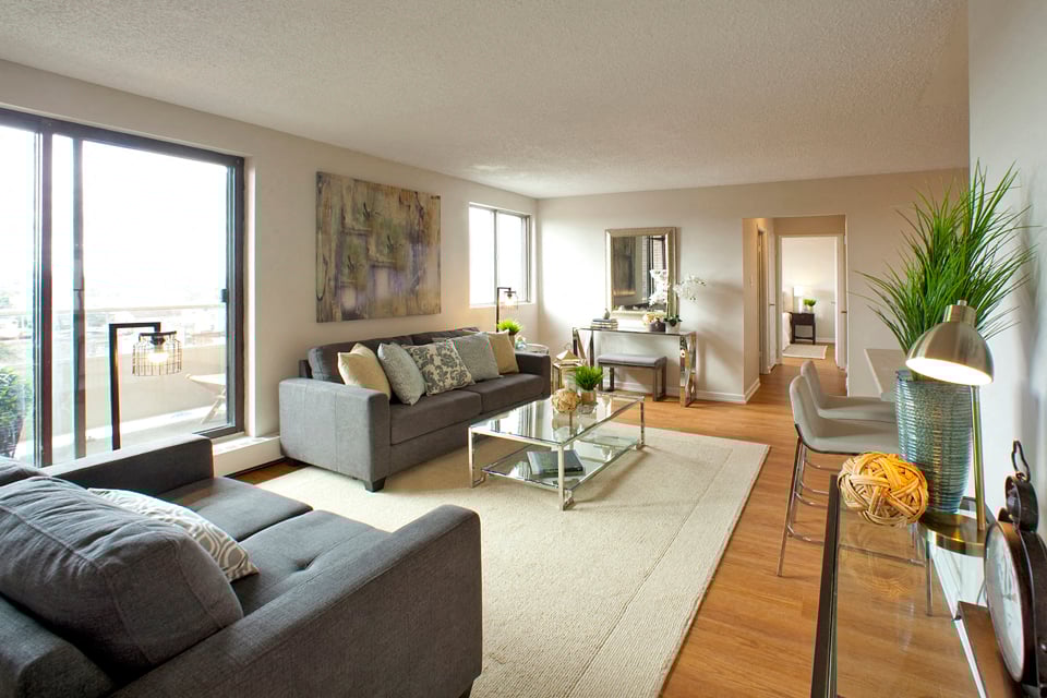 Millside Tower spacious living room with access to balcony in Milton, ON