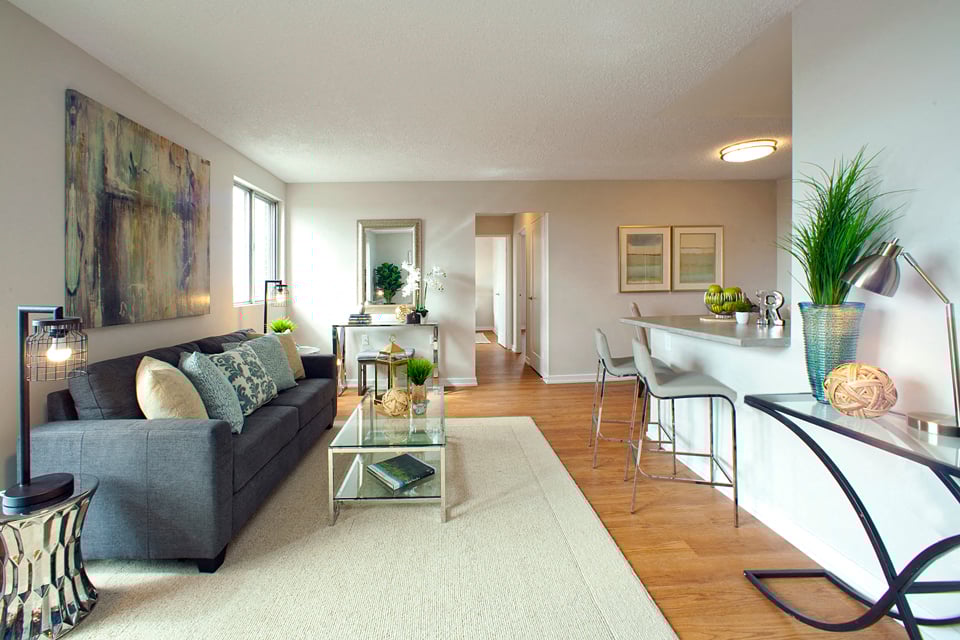 Millside Tower spacious living room with view of kitchen in Milton, ON