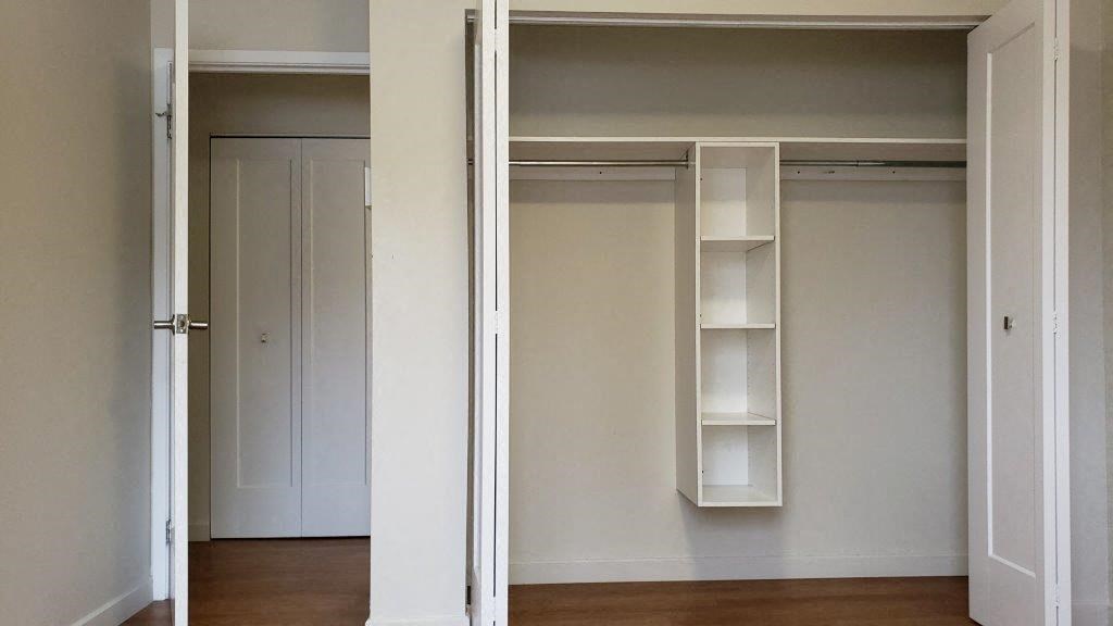 Primary bedroom closet in a revitalized open-concept suite at Moira Apartments in Belleville, ON.