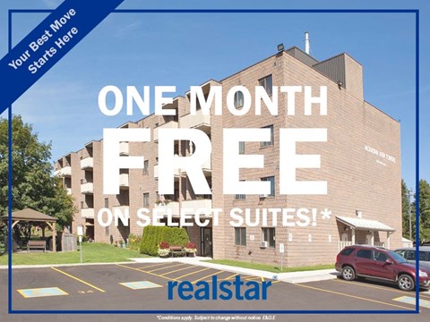 a picture of a building with the text one month free on select suites