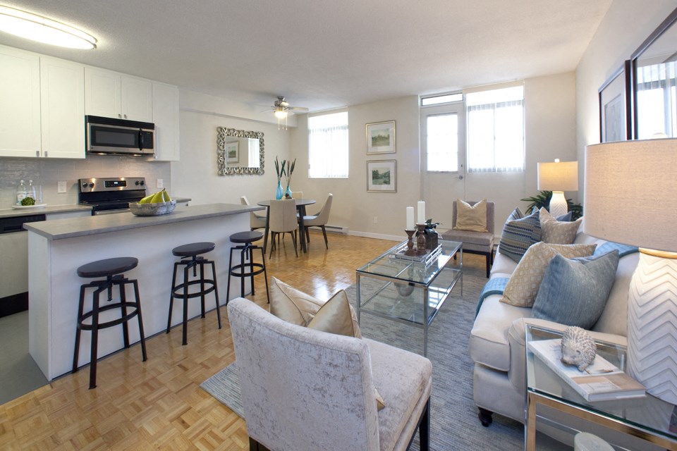Northumberland Place open concept suite with view of kitchen and dining area from living room in Port Hope, ON