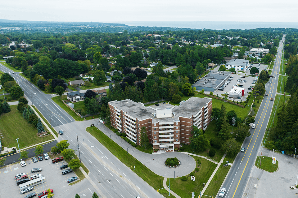 Northumberland Place image of drone exterior of building featuring the lake in Port Hope, ON