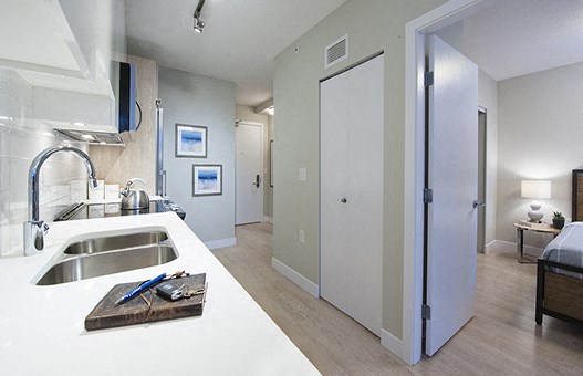 Kitchen counter with an open door to the bedroom