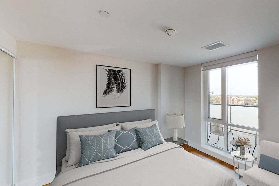 Nuovo Apartments in Ottawa, ON  bedroom with large window and closet